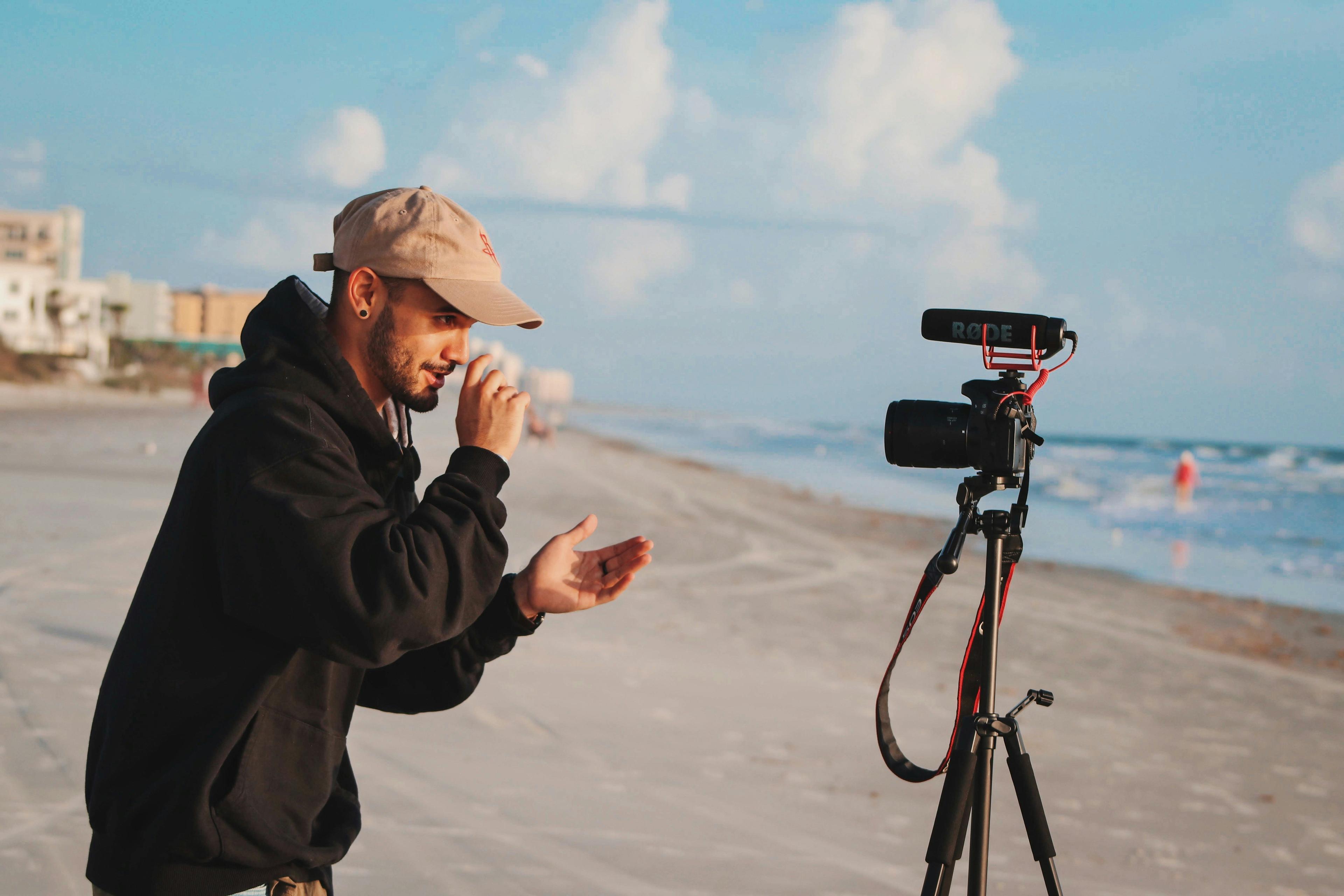 A content creator holding a camera